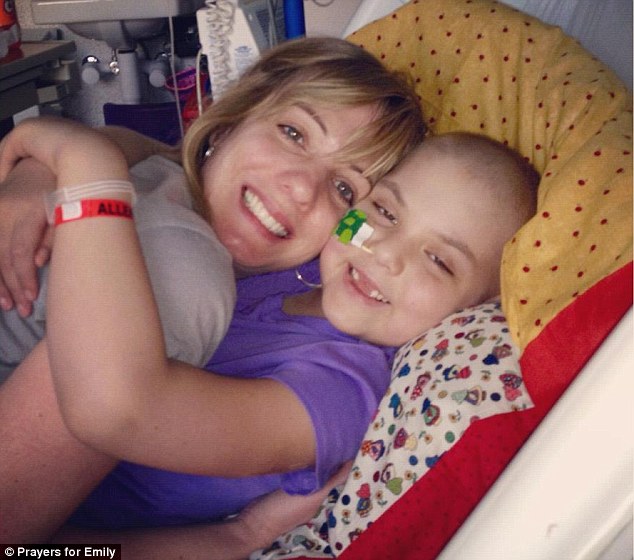 Big hugs: Emily was diagnosed with acute lymphoblastic leukemia (ALL) in May 2010