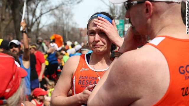 A runner reacts near Kenmore Square after the explosions.