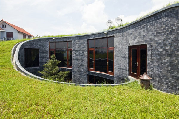 green home 5 Spectacular Torus Shaped Stone House With Sustainable Features in Vietnam