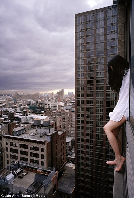 Crouch: A camera with a timer allows the South Korean to capture herself in a series of poses