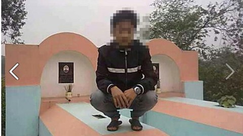 Dân mạng 'truy lùng' nam thanh niên ngồi lên mộ chụp ảnh