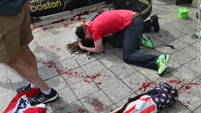 A man comforts a victim on the sidewalk at the scene of the first of two apparent bombings near the finish line of the Boston Marathon on Monday, April 15. &lt;a  data-cke-saved-href='http://www.cnn.com/2013/04/15/us/boston-marathon-explosions/index.html' href='http://www.cnn.com/2013/04/15/us/boston-marathon-explosions/index.html'&gt;Read our developing news story&lt;/a&gt; and follow up-to-the-minute reports &lt;a  data-cke-saved-href='http://news.blogs.cnn.com/2013/04/15/explosions-near-finish-of-boston-marathon/' href='http://news.blogs.cnn.com/2013/04/15/explosions-near-finish-of-boston-marathon/'&gt;on CNN.com's This Just In blog&lt;/a&gt;.