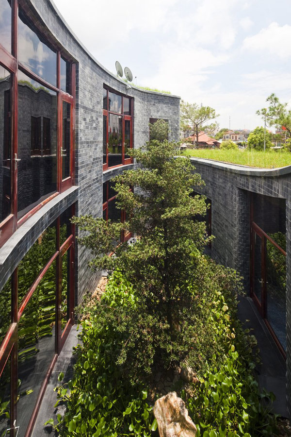 green home 7 Spectacular Torus Shaped Stone House With Sustainable Features in Vietnam